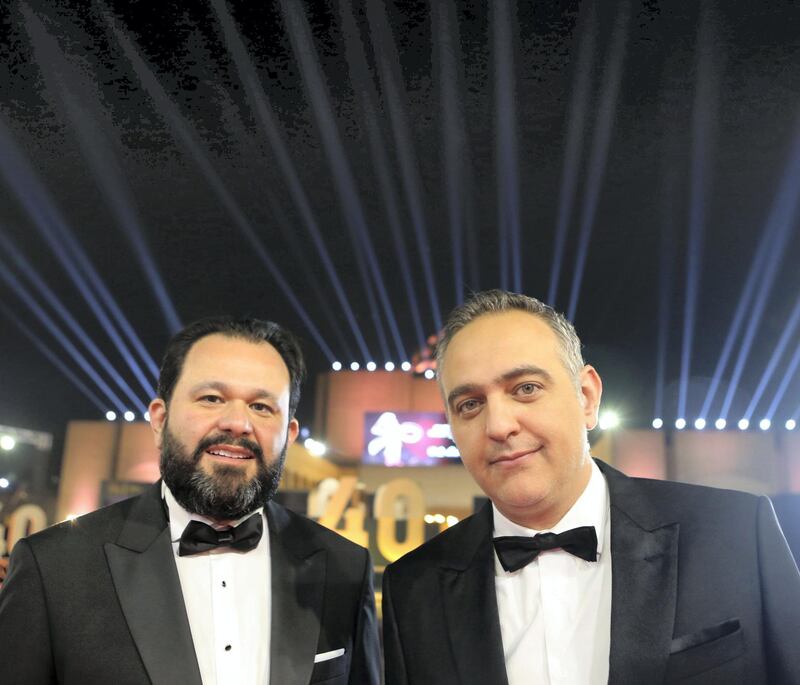 Cairo International Film Festival executive director Omar Kassem (L) and President Mohamed Hefzy pose on the red carpet at the closing ceremony of the 40th edition of the Cairo International Film Festival (CIFF) at the Cairo Opera House in the Egyptian capital (CIFF) at the Cairo Opera House in the Egyptian capital on November 29, 2018. (Photo by PATRICK BAZ / Cairo International Film Festival / AFP) / RESTRICTED TO EDITORIAL USE - MANDATORY CREDIT "AFP PHOTO / CAIRO INTERNATIONAL FILM FESTIVAL" - NO MARKETING - NO ADVERTISING CAMPAIGNS - DISTRIBUTED AS A SERVICE TO CLIENTS