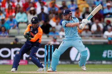 England's Jonny Bairstow, right, and India's MS Dhoni had contrasting days in the office on Sunday. Paul Childs / Reuters