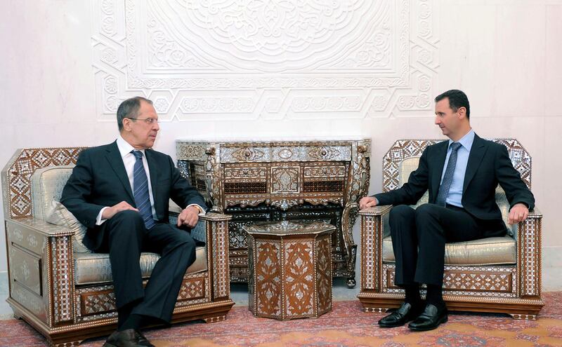 Syria's President Bashar al-Assad (R) meets Russian Foreign Minister Sergei Lavrov in Damascus, February 7, 2012, in this handout photograph released by Syria's national news agency SANA. Lavrov began talks with Syrian President Bashar al-Assad on Tuesday by saying Moscow wants Arab peoples to live in peace and the Syrian leader is aware of his responsibility, Russian news agency RIA reported. REUTERS/SANA (SYRIA - Tags: POLITICS) FOR EDITORIAL USE ONLY. NOT FOR SALE FOR MARKETING OR ADVERTISING CAMPAIGNS. THIS IMAGE HAS BEEN SUPPLIED BY A THIRD PARTY. IT IS DISTRIBUTED, EXACTLY AS RECEIVED BY REUTERS, AS A SERVICE TO CLIENTS *** Local Caption ***  SYR08_SYRIA-RUSSIA-_0207_11.JPG