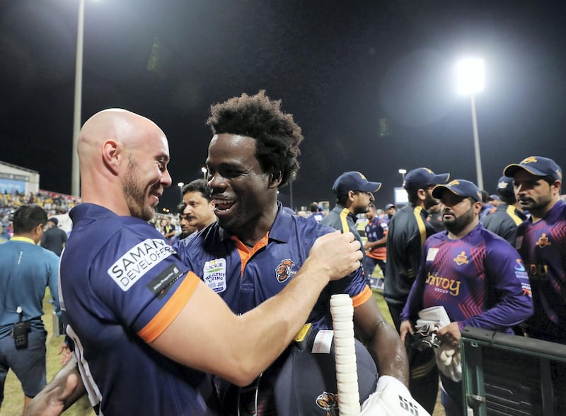 Abu Dhabi, United Arab Emirates - November 24, 2019: Arabians' Chadwick Walton (R) and Chris Lynn celebrate winning the final between the Deccan Gladiators and the Maratha Arabians in the Abu Dhabi T10 league. Sunday, November 24th, 2017 at Zayed Cricket Stadium, Abu Dhabi. Chris Whiteoak / The National