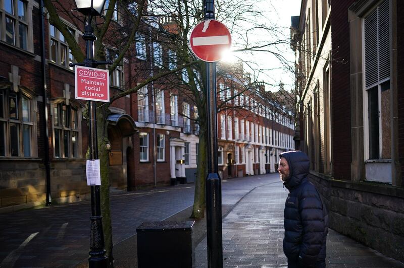 A Covid 19 sign is displayed on an empty street in Hull. Getty Images