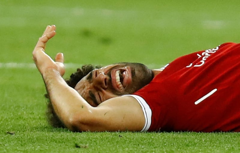 Soccer Football - Champions League Final - Real Madrid v Liverpool - NSC Olympic Stadium, Kiev, Ukraine - May 26, 2018   Liverpool's Mohamed Salah reacts after sustaining an injury                    REUTERS/Kai Pfaffenbach