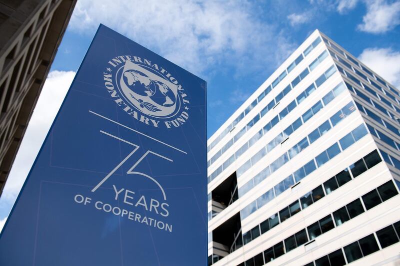 Signs for the upcoming IMF / World Bank Annual Meetings hang outside International Monetary Fund Headquarters in Washington, DC on October 7, 2019. / AFP / SAUL LOEB
