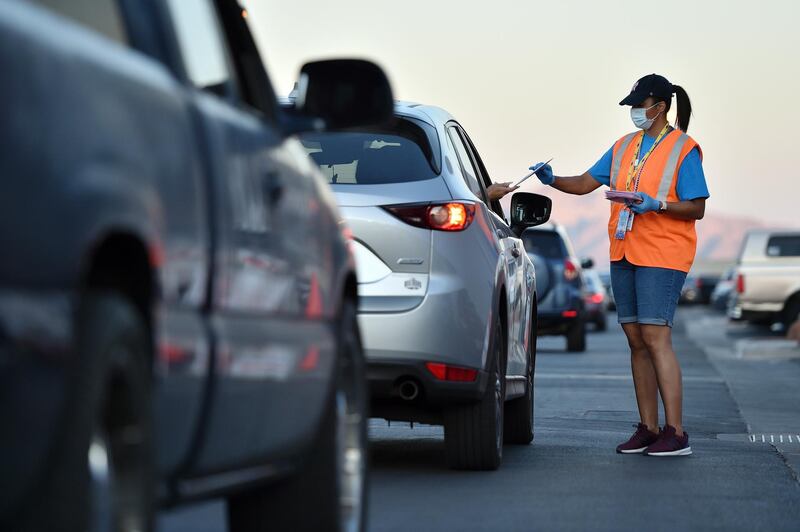 A election worker collects mail-in ballots at the Clark County election office in Las Vegas, Nevada.  EPA