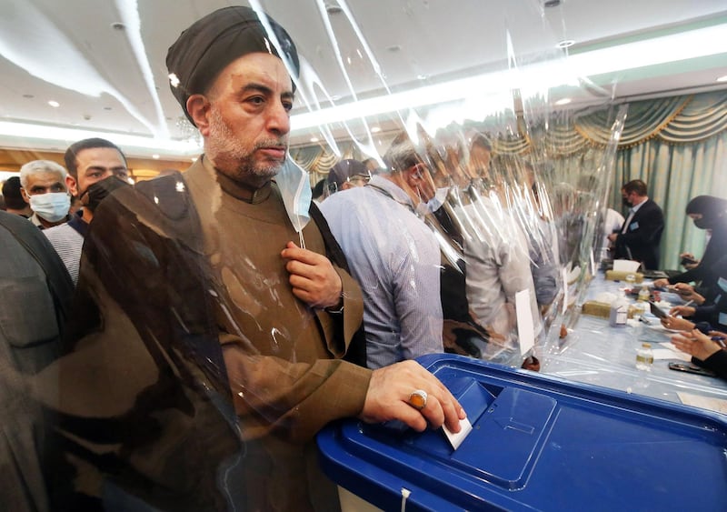 An Iranian cleric casts his vote for the the Islamic republic's presidential election at the Iranian embassy in Kuwait City.  AFP