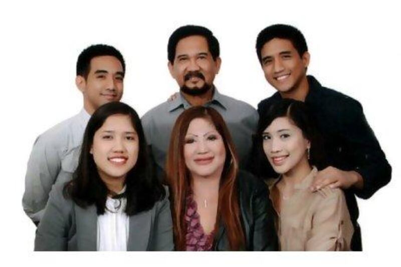 Lorna Lim Varona, centre, and some of her family. The businesswoman's body was found stuffed in a bag in her car.