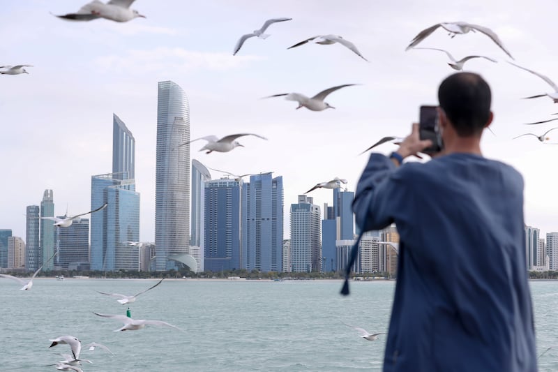 The Abu Dhabi skyline. Non-oil business activity in the UAE improved in August amid sharp uplift in new order volumes. Khushnum Bhandari / The National