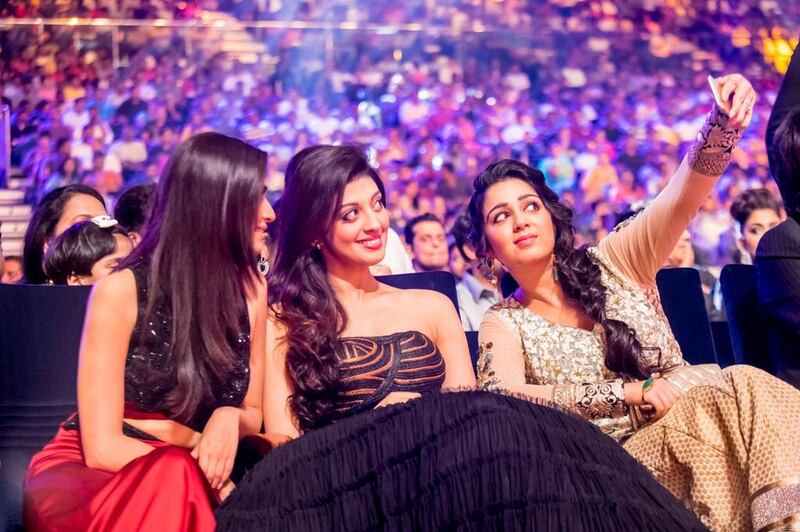 Actresses Kriti Kharbanda, Praneetha Subhash and Charmme Kaur taking a selfie at 2015 SIIMA awards held in Dubai. Courtesy Siima