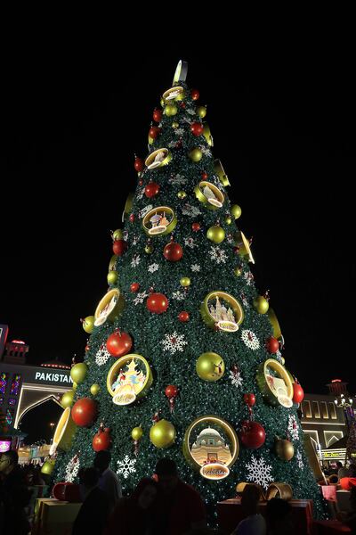 Global Village's 21-m-tall Christmas tree celebrates cultures from around the world. Pawan Singh / The National