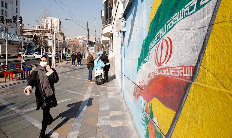 A mural depicting the Iranian national flag in Tehran. EPA