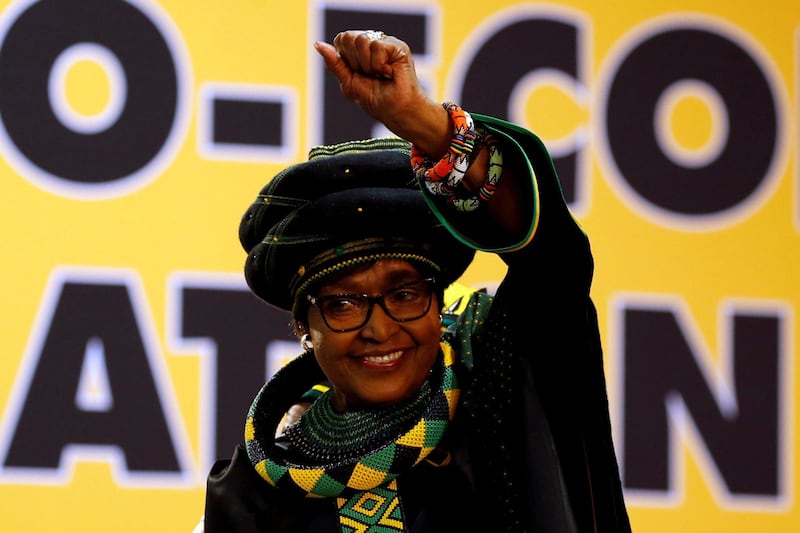 FILE PHOTO: Winnie Madikizela Mandela, ex-wife of former South African president Nelson Mandela, gestures to supporters at the 54th National Conference of the ruling African National Congress (ANC) at the Nasrec Expo Centre in Johannesburg, South Africa December 16, 2017. REUTERS/Siphiwe Sibeko/File Photo