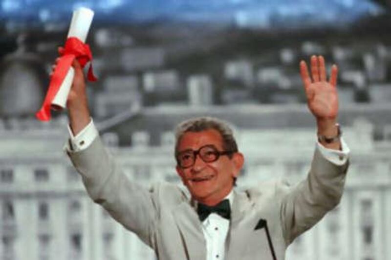 Youssef Chahine reacts after winning the Cannes film festival 50th anniversary award for his life's work.