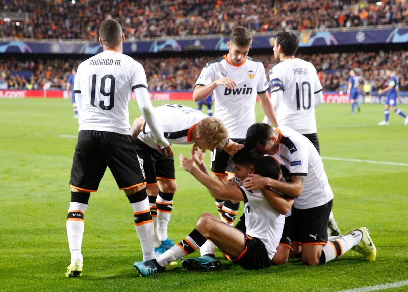 Valencia's players celebrate after Carlos Soler opened the scoring. AP