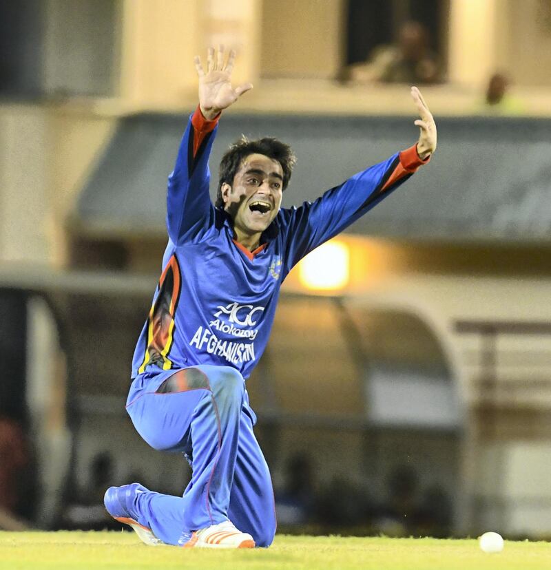 Rashid Khan of Afghanistan appeals for another wicket during the 1st ODI match between West Indies and Afghanistan at Darren Sammy National Cricket Stadium, Gros Islet, St. Lucia, June 09, 2017. / AFP PHOTO / Randy Brooks