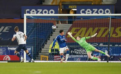 Tottenham's Harry Kane, left, scores his side's second goal during the English Premier League soccer match between Everton and Tottenham Hotspur at Goodison Park in Liverpool, England, Friday, April 16, 2021. (AP Photo/Jon Super, Pool)