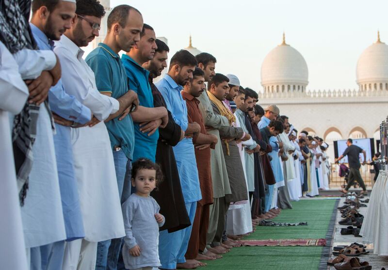 Abu Dhabi, UNITED ARAB EMIRATES - Faithfuls are performing morning prayers on the first day of Eid-Al Fitr at the Sheikh Zayed Grand Mosque.  Leslie Pableo for The National