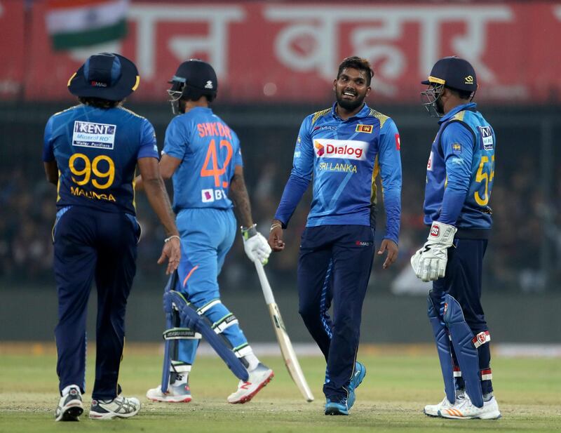 Sri Lanka bowler Wanindu Hasaranga, second right, celebrates after a successful review for the wicket of India's Shikhar Dhawan. AP