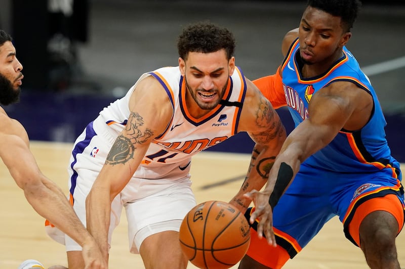 Phoenix Suns forward Abdel Nader battles Oklahoma City Thunder guard Hamidou Diallo for the ball. AP