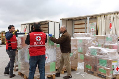 Staff from the International Committee of the Red Cross (ICRC) prepare boxes of humanitarian aid in Amman, before loading it on a plane destined to Port Sudan. AFP Photo