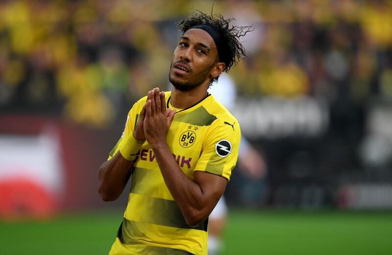 (FILES) This file photo taken on September 23, 2017 shows Dortmund's Gabonese striker Pierre-Emerick Aubameyang reacting during a German First division Bundesliga football match Borussia Dortmund vs Borussia Moenchengladbach in Dortmund, western Germany. 
According to German tabloid Bild reports on January 17, 2018, Aubameyang is close to sign with Arsenal London. He was dropped by Borussia Dortmund after missing a team meeting. / AFP PHOTO / PATRIK STOLLARZ