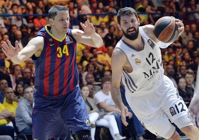Nikola Mirotic, right, and Real Madrid beat Barcelona by 38 points in the Euroleague semi-finals on Friday. Daniel Dal Zennaro / EPA / May 16, 2014
