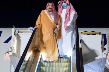 Saudi Arabia's King Salman arrives disembarks from his plane at the Neom economy zone's airport on August 12, 2020. SPA