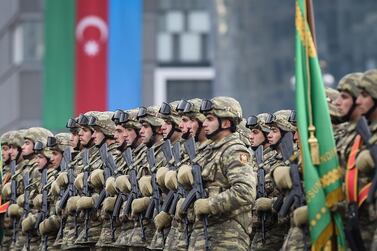 Azerbaijani soldiers during a military parade dedicated to the victory in the Nagorno-Karabakh armed conflict, in Baku, Azerbaijan, on December 20, 2020. EPA