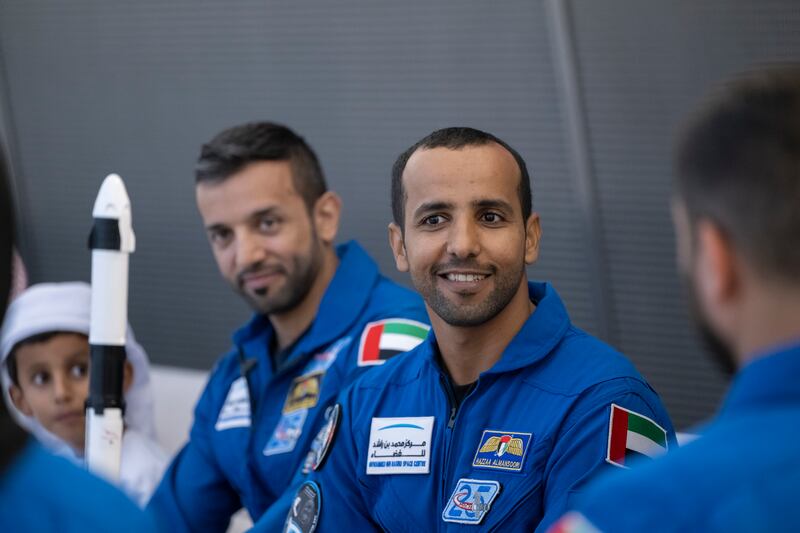 Hazza Al Mansouri, right, attends the homecoming for Dr Al Neyadi, who spent six months at the International Space Station. Photo: UAE Presidential Court 