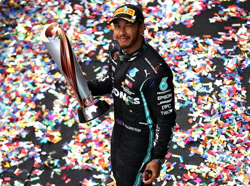 Race winner Lewis Hamilton of Great Britain and Mercedes GP celebrates winning a 7th F1 World Drivers Championship on the podium during the F1 Grand Prix of Turkey at Intercity Istanbul Park on November 15, 2020 in Istanbul, Turkey. Getty Images