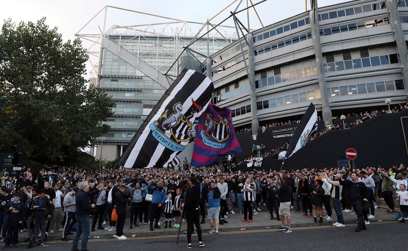 Newcastle United supporters celebrate outside St  James' Park  after it was announced the Premier League club had been taken over by Saudi Arabian-led consortium, on Thursday, October 7. AP