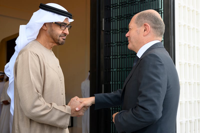 President Sheikh Mohamed shakes hands with German Chancellor Olaf Scholz, at Al Shati Palace in Abu Dhabi. Photo: UAE Presidential Court