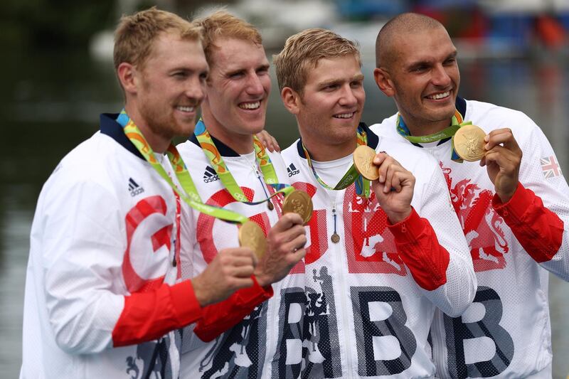 RIO DE JANEIRO, BRAZIL - AUGUST 12:  Gold medalists Alex Gregory, Mohamed Sbihi, George Nash and Constantine Louloudis of Great Britain pose for photographs on the podium at the medal ceremony for the Men's Four on Day 7 of the Rio 2016 Olympic Games at Lagoa Stadium on August 12, 2016 in Rio de Janeiro, Brazil.  (Photo by Patrick Smith/Getty Images)