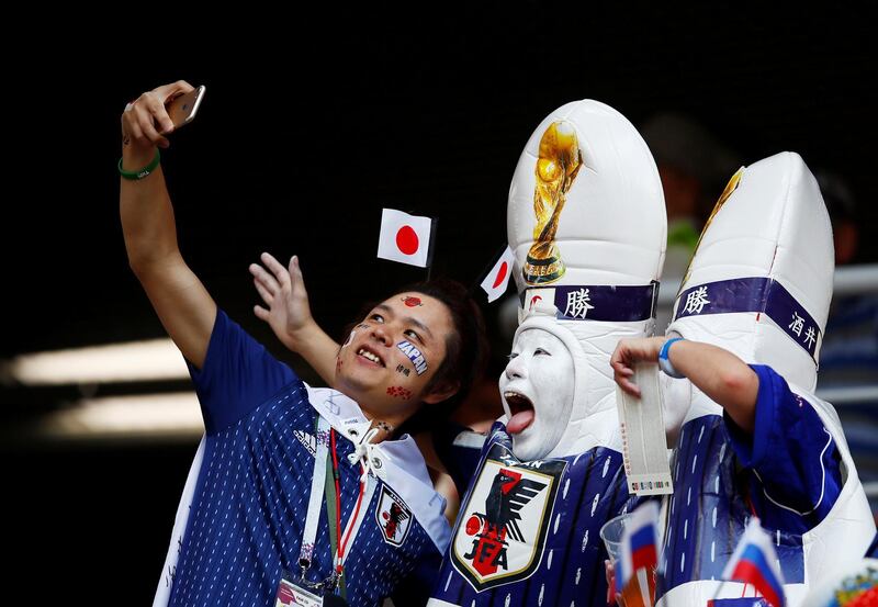 Japan fans take a selfie before the World Cup match against Colombia. Jason Cairnduff / Reuters