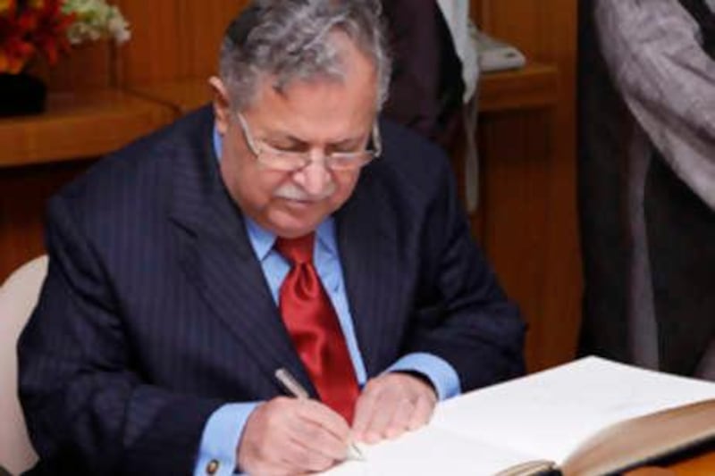 Jalal Talabani, President of Iraq, signs a guest book at the beginning of a meeting with U.N. Secretary General Ban Ki-moon (not pictured) during the United Nations General Assembly, at U.N. Headquarters in New York, September 22, 2008.  REUTERS/Chip East  (UNITED STATES) *** Local Caption ***  NYK715D_UN-ASSEMBLY_0922_11.JPG