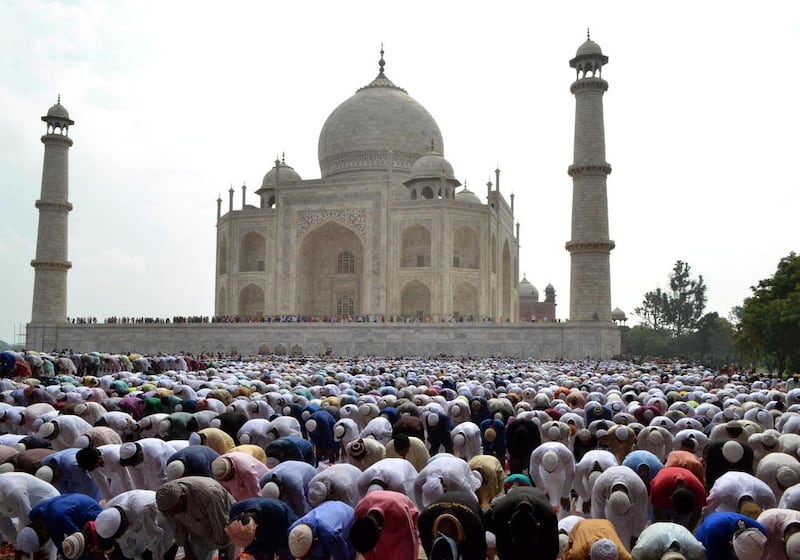 Indian Muslims offer prayers in the premises of the Taj Mahal in Agra, India, Saturday, July 18, 2015. Millions of Muslims across the world are celebrating the Eid Al Fitr holiday, which marks the end of the month-long fast of Ramadan. Pawan Sharma / AP photo