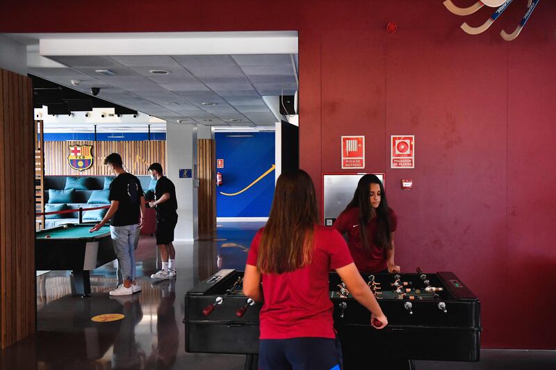 Barcelona's women's B team Spanish goalkeeper Laura Coronado plays table football with teammate Claudia Riumallo Pineda after a training session at La Masia. AFP