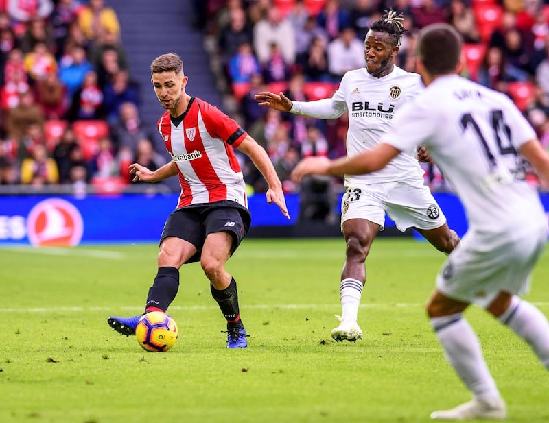 Athletic Bilbao's Yeray Alvarez in action against Valencia players Michy Batshuayi and Gaya. EPA