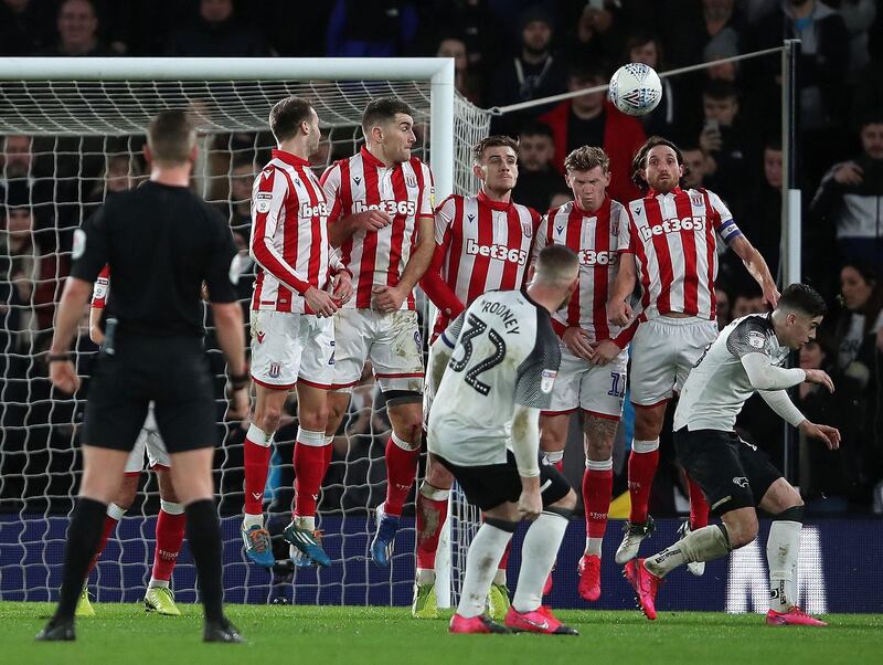 Wayne Rooney scores Derby's third goal from a free-kick. Reuters