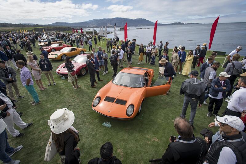 Judges and attendees view the 1968 Lamborghini Miura P400 Bertone Coupe during the 2019 Pebble Beach Concours d'Elegance in Pebble Beach, California. Bloomberg