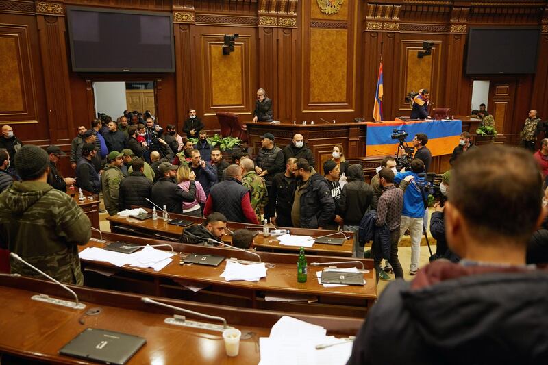 Protestors storm the Armenian parliament building after the announcement of a peace deal in the war between Armenia and Azerbaijan in Yerevan, Armenia. Getty Images