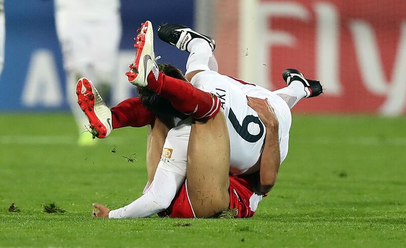 Shojae Khalilzadeh of Perseolis and Ryota Nagaki of Kashima Antlers get tangled during the Asian Champions League final second leg. Getty Images