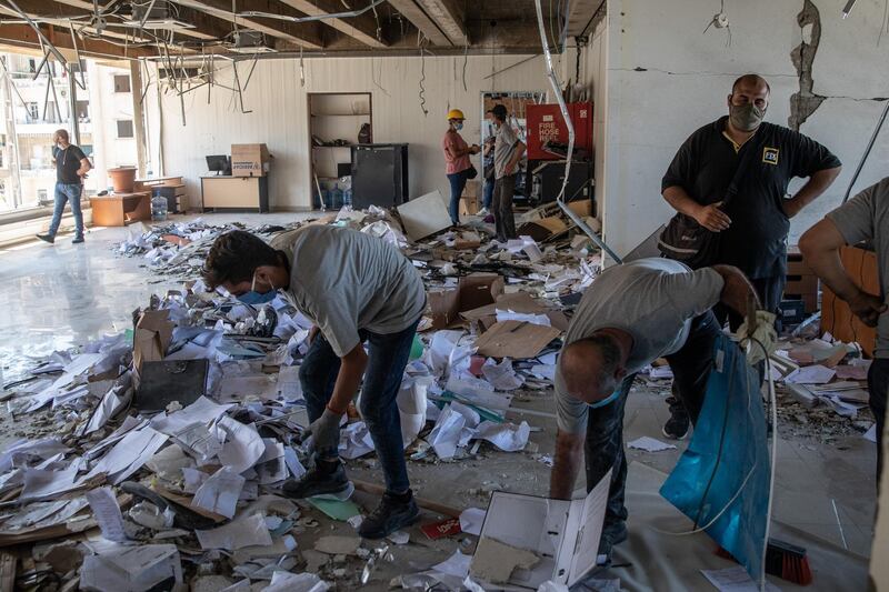 BEIRUT, LEBANON - AUGUST 17: Employees clear rubble inside the destroyed Lebanon Electricity Company (EDL) building on August 17, 2020 in Beirut, Lebanon. The explosion at Beirut's port killed over 200 people, injured thousands, and upended countless lives. There has been little visible support from government agencies to help residents clear debris and help the displaced, although scores of volunteers from around Lebanon have descended on the city to help clean. (Photo by Chris McGrath/Getty Images)