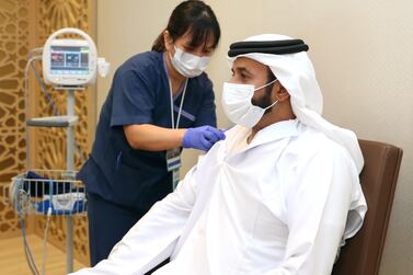 The director general of the National Emergency, Crisis and Disasters Management Authority, Obaid Al Shamsi, taking the vaccine. Wam