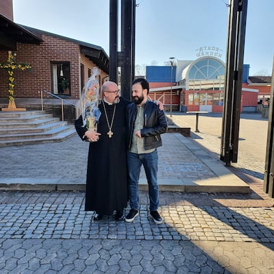 Rev Fredrik Hollertz, with a member of the community. outside his church in Jonkoping, Sweden. Photo: Rev Fredrik Hollertz