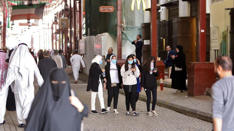 Kuwaiti women wear protective masks at the Mubarakiya Market in Kuwait City.  AFP