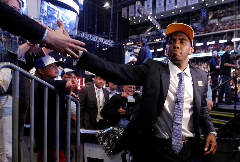 Kyrie Irving, a former Duke basketball player, is congratulated after being take with the No. 1 pick by the Cleveland Cavaliers during the NBA basketball draft, Thursday, June 23, 2011, in Newark, N.J. (AP Photo/Julio Cortez)