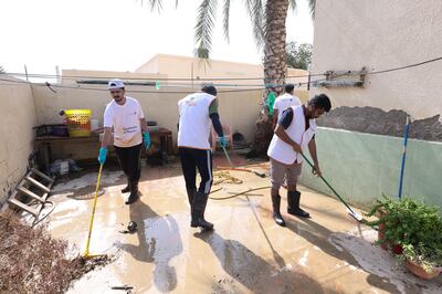 Aster Volunteers clean up floodwaters in Fujairah.