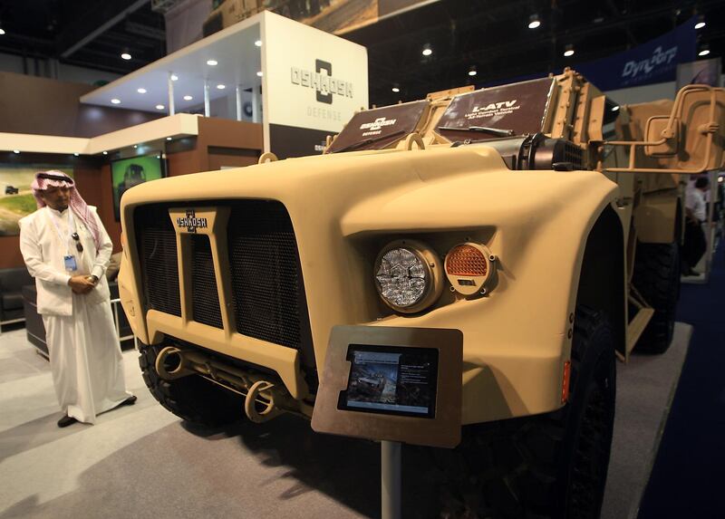 ABU DHABI - UNITED ARAB EMIRATES - 21FEB2013 -  A visitor looks at light tactical vehicle displayed at Oshkosh defence pavillion at International Defence Exhibition and Conference, IDEX 2013 on the last day yesterday at Abu Dhabi National Exhibition Centre. Ravindranath K / The National