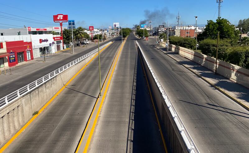 A deserted street in Culiacan after clashes between federal forces and gang members. EPA 