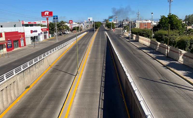 A deserted street in Culiacan after clashes between federal forces and gang members. EPA 